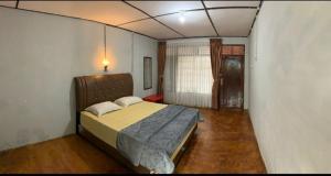 Postel nebo postele na pokoji v ubytování Bungalow Karo Hill