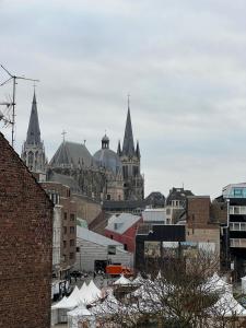 a view of a city with a bunch of buildings at Domblick Apartment in Aachen