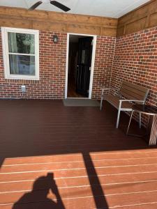 a shadow of a person standing on a patio at Spacious comfortable Studio Unit in Tallahassee
