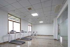 a large room with a row of chairs in it at Floral design Longhu Mountain Residence in Caijia