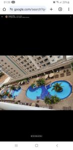 ein Screenshot der Website eines Resorts mit zwei Pools in der Unterkunft APARTAMENTO OLIMPIA PARK RESORT 503 c in Olímpia