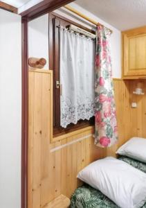 Postel nebo postele na pokoji v ubytování Appartement confortable à Mont-Saxonnex 25m² avec balcon