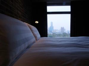 Postel nebo postele na pokoji v ubytování City Suites - Kaohsiung Pier2