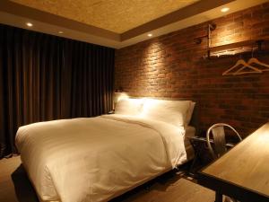 Postel nebo postele na pokoji v ubytování City Suites - Kaohsiung Pier2