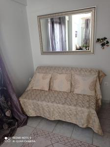 A bed or beds in a room at "By The Sea" Family apartments