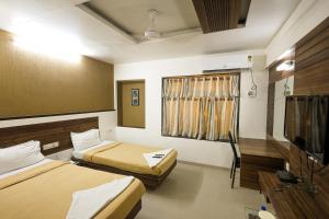 Hotel New Apex客房内的一张或多张床位