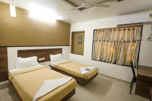 Hotel New Apex客房内的一张或多张床位