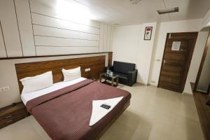 Hotel New Apex客房内的一张或多张床位