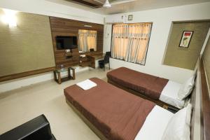 Hotel New Apex客房内的一张或多张床位