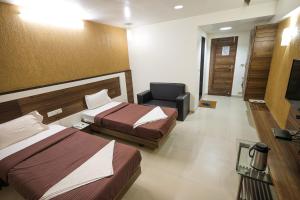 Hotel New Apex客房内的一张或多张床位
