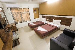 Hotel New Apex客房内的一张或多张床位