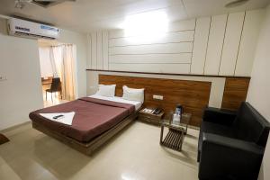 Hotel New Apex客房内的一张或多张床位