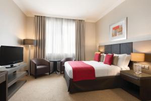 A television and/or entertainment centre at Ramada Downtown Abu Dhabi