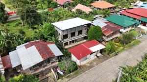 an overhead view of a building with red roofs at Tsada Balay Homestay in Guindulman