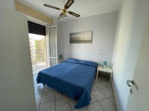 Postel nebo postele na pokoji v ubytování Residenza Lido adriano baia tartaruga
