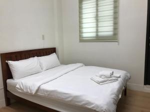 Postel nebo postele na pokoji v ubytování 享居Enjoy Live 民宿