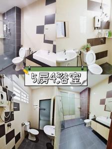a bathroom with two sinks and two toilets at Ipoh Botani Home 25 by verve 5B4B 25 pax in Ipoh