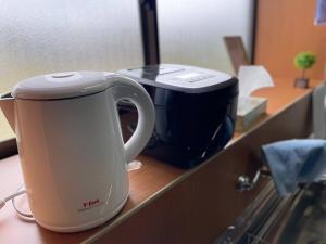 a coffee maker sitting on top of a counter at あその五岳 in Aso