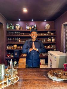 a man standing in front of a bar with his hands at Chakra Living Sayan - Bali Maison in Ubud +78 photos