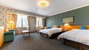 Postel nebo postele na pokoji v ubytování Satoyama Auberge & Hot Spring Wellness Spa Sakuragaike Kurgarden + 37 fotografií