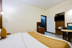 Postel nebo postele na pokoji v ubytování The Pamposh Hotel