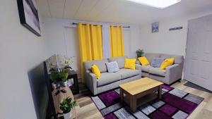 a living room with a couch and a table at Fairbanks Rafiki Unit 2 in Fairbanks
