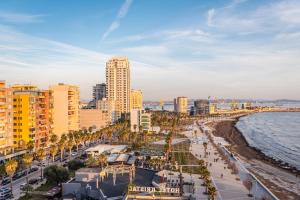 a view of a beach with buildings and the ocean at Aria Apartment in Durrës