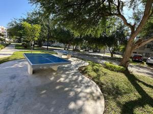 a ping pong table sitting in the middle of a park at Departamento en Puerto Vallarta in Puerto Vallarta
