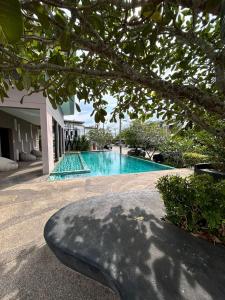 a swimming pool in the middle of a house at Phuket House House with excellent location and excellent views Sleeping area Отличный Дом, Комната со всеми удобствами in Phuket Town