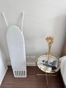 a room with a glass table next to a bed at Phuket House House with excellent location and excellent views Sleeping area Отличный Дом, Комната со всеми удобствами in Phuket Town