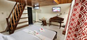 Postel nebo postele na pokoji v ubytování Nanay Eustiquia Complex Beach Resort