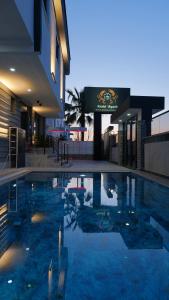 a large swimming pool in front of a building at Krabi Apart in Lara
