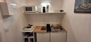 Η κουζίνα ή μικρή κουζίνα στο appartement central chez Eric N4 +4 φωτογραφίες