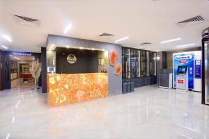 a lobby with a display in the center of a building at Hotel Bulvar Palas in Istanbul