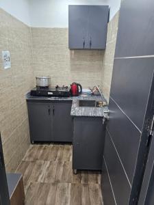 Eldhús eða eldhúskrókur á Hen-Cap Apartment Services
