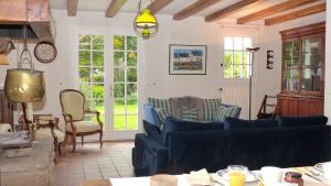 a living room with blue couches and chairs at Maison familiale a 700m de la plage de Kervillen in La Trinité-sur-Mer +37 photos