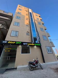 a motorcycle parked in front of a building at IVY Lemon Green in Bengaluru