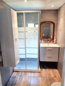 a bathroom with a sink and a mirror at Charming House in Irañeta with Fenced Garden in Irañeta
