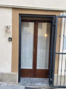 a door to a building with a glass at La Casetta sul Lago in Viverone