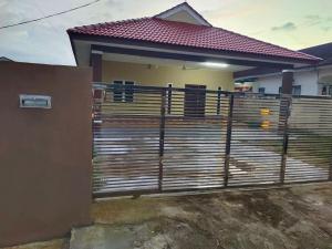 a fence in front of a house at DeStay Taiping in Taiping