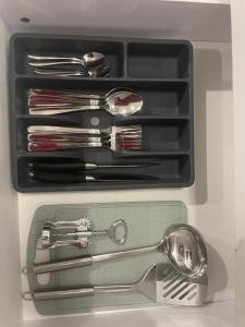 a drawer full of utensils in a refrigerator at Azaliya in Lazeshchyna