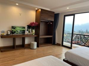 Postel nebo postele na pokoji v ubytování Sapa Warm Hotel