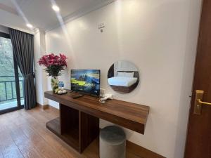 TV a/nebo společenská místnost v ubytování Sapa Warm Hotel
