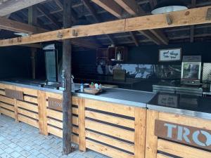 a food counter in a restaurant with a wooden fence at Hotel Zur Mühle in Iserlohn