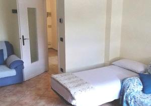 a bedroom with a bed and a door to a room at Appartamento ZOIA in Crevacuore