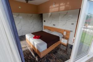 Postel nebo postele na pokoji v ubytování Vagamon Springs