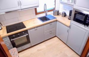a small kitchen with a sink and a stove at Ferienhaus 1 In Kirchheim in Kirchheim