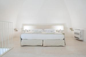Uma cama ou camas num quarto em Dimora Dell'Osanna