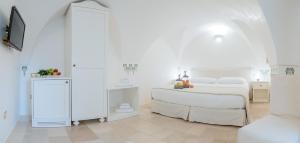 Uma cama ou camas num quarto em Dimora Dell'Osanna