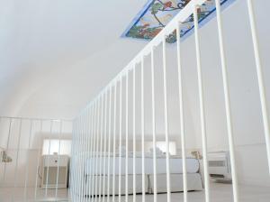 Uma cama ou camas num quarto em Dimora Dell'Osanna